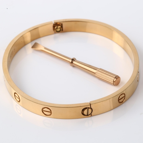 CARTIER - a modern 18ct gold 'LOVE' bangle, with screwhead motifs ...