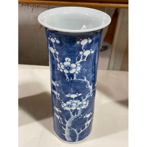 162 - A pair of Chinese blue and white Prunus cylinder vases, height 21cm