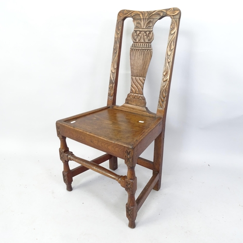 2092 - An antique carved oak hall chair