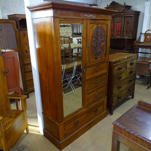 2094 - An Arts and Crafts oak Beaconsfield style wardrobe. 130 x 195 x 50cm. With key.