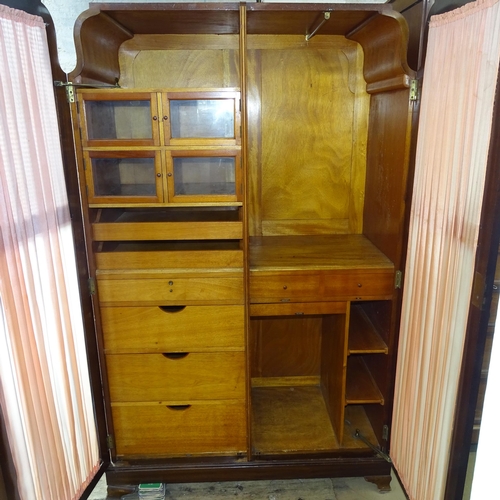 2097 - A 1930s Art Deco mahogany two door wardrobe. 122cm x 188cm x 58cm (with key)