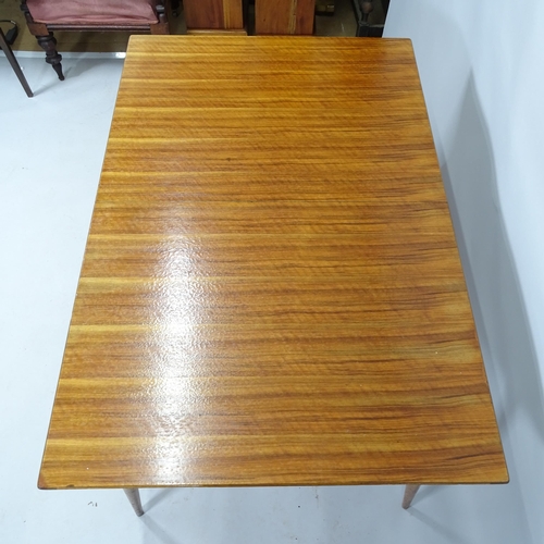 2099 - A mid-century teak draw-leaf extending dining table. 129cm (extending to 174cm) x 74cm x 867cm