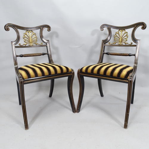 2102 - A pair of ebonised empire style side chairs