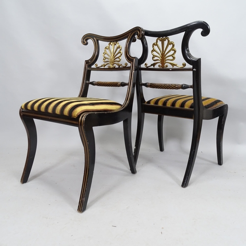 2102 - A pair of ebonised empire style side chairs