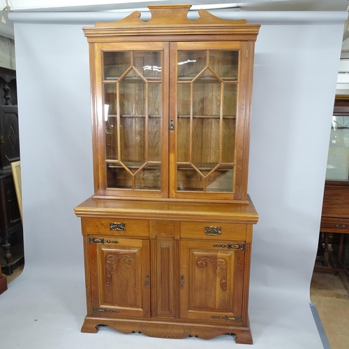 2111 - A two-section mahogany library bookcase, with two glazed panelled doors, two fitted drawers and cupb... 