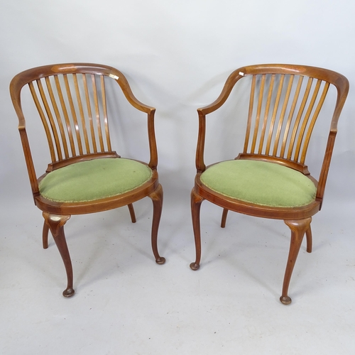 2119 - A pair of Edwardian mahogany and satinwood strung  tub chairs with marquetry inlaid decoration.