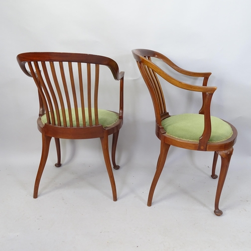 2119 - A pair of Edwardian mahogany and satinwood strung  tub chairs with marquetry inlaid decoration.