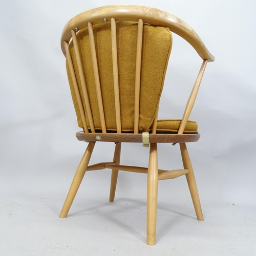 2127 - A mid-century Ercol elm model 338 bow arm chair. 58cm x 68cm x 43cm