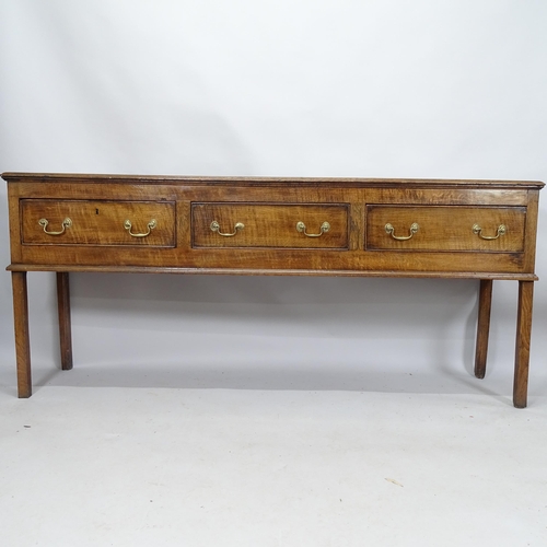 2130 - A 19th century oak dresser base with three frieze drawers. 203cm x 87cm x 45cm