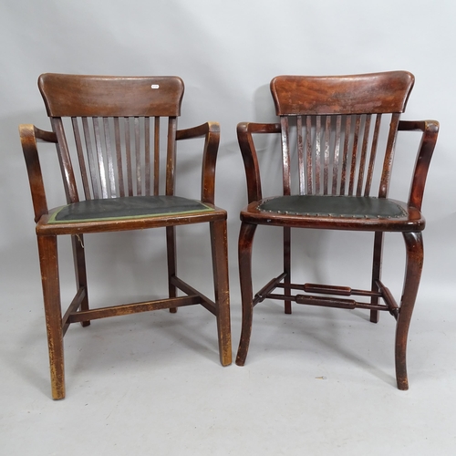 2143 - A matched pair of early 20th century oak armchairs.