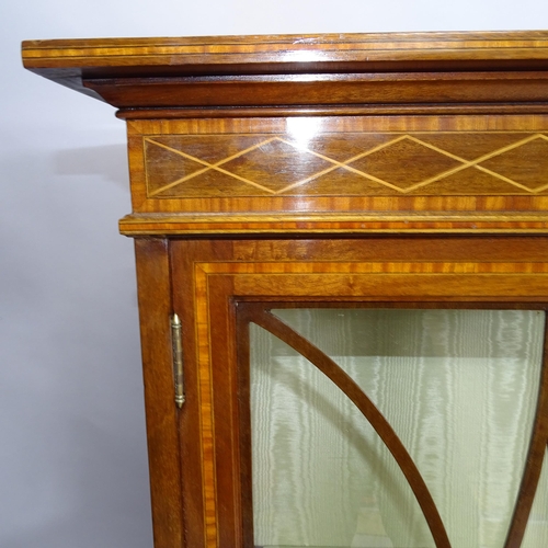 2152 - An antique mahogany and satinwood strung display cabinet with two glazed doors. 110cm x 139cm x 40cm... 