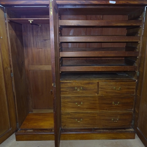 2158 - A 19th century mahogany three door wardrobe in four sections, the single section opening to a hangin... 