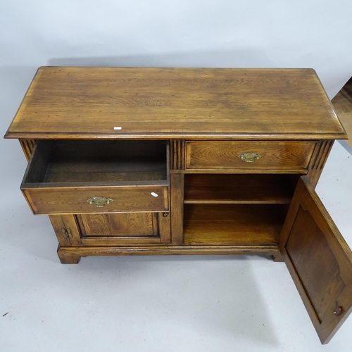 2160 - An Ipswich oak design sideboard with two fitted drawers and cupboards under. 118cm x 85cm x 45cm