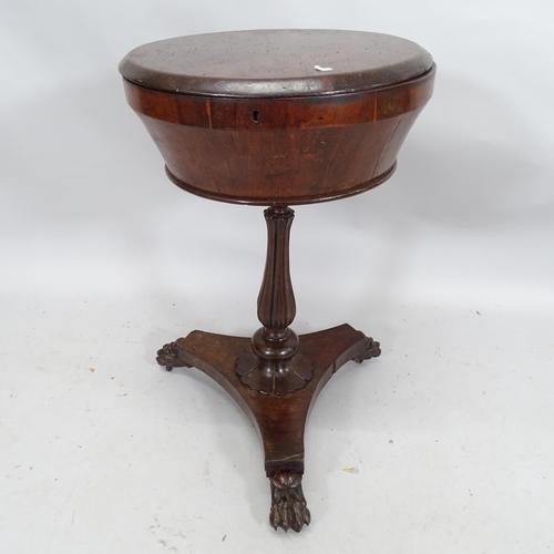 2162 - An antique rosewood circular teapoy raised on turned and fluted column with lion paw feet. 60cm x 75... 