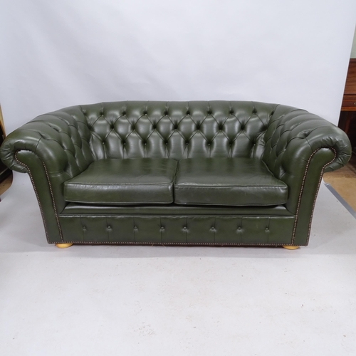 2172 - A contemporary green studded leather button back two seat chesterfield style sofa. 185cm x 76cm x 97... 