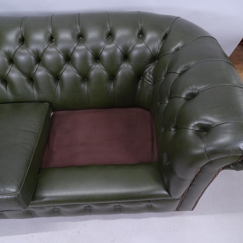 2172 - A contemporary green studded leather button back two seat chesterfield style sofa. 185cm x 76cm x 97... 