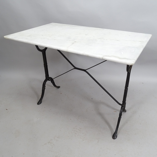 2174 - A marble top garden table on cast iron frame. 100cm x 74cm x 62cm