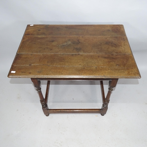 2175 - A 17th century joined oak side table on bobbin turned legs. 79cm x 68cm x 54cm