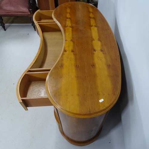 2182 - A mid-century design yew-wood kidney shaped kneehole writing desk with eleven fitted drawers. 123cm ... 