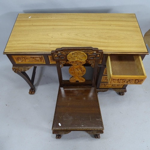 2187 - A modern Chinese camphor wood single pedestal writing desk with 5 fitted drawers and all over carved... 