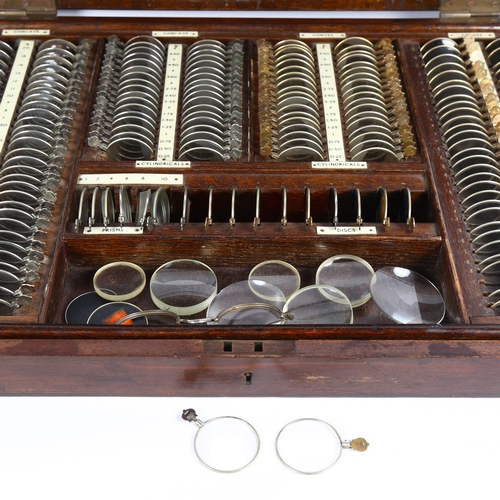 1 - An early 20th century cased set of Optician's lenses, including concave, convex and sphericals, and ... 