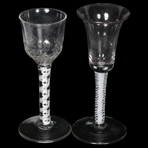 100 - 2 Georgian wine/liqueur glasses, 1 having a dimpled bowl on a lattice milk twist stem, the other hav... 