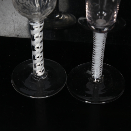 100 - 2 Georgian wine/liqueur glasses, 1 having a dimpled bowl on a lattice milk twist stem, the other hav... 