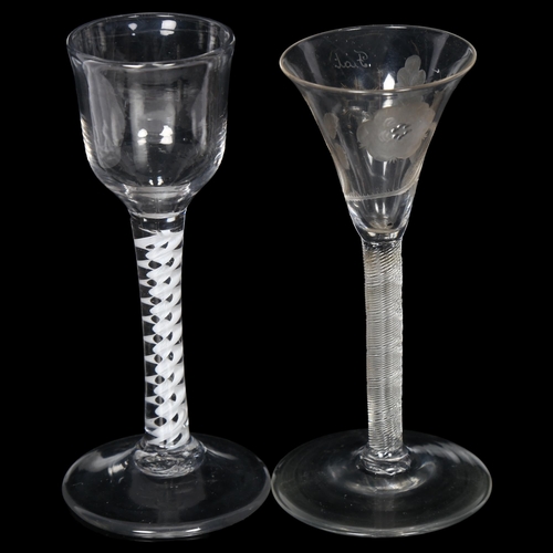 101 - A Georgian cordial glass with milk twist stem, H15.5cm, and an 18th century cordial glass with spira... 