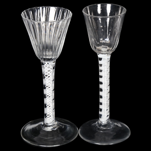 104 - 2 x 18th century cordial glasses, 1 having a fluted bowl on a multiple twist white glass twist stem,... 