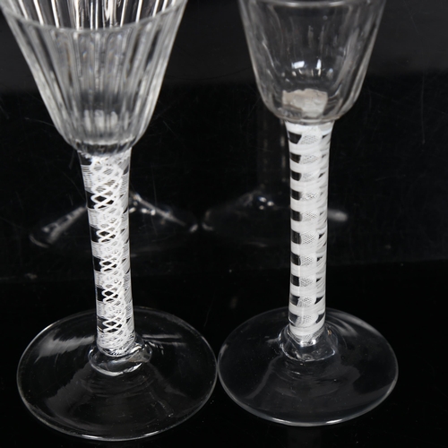 104 - 2 x 18th century cordial glasses, 1 having a fluted bowl on a multiple twist white glass twist stem,... 