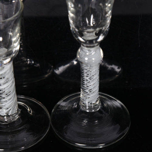 106 - A Georgian L-shaped wine glass, with air twist stem, and a liqueur glass, with air twist stem, H17cm... 