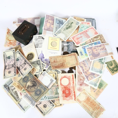 122 - A collection of various world banknotes, including American dollars, Indian, Trinidad and Tobago etc... 