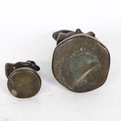 128 - 2 Burmese bronze opium weights, in the form of mythical figures, largest 9.5cm