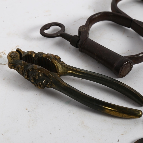 129 - A 19th century Hiatt Irish 8 handcuffs, with Hiatt impressed on the key and cuffs, an Antique bronze... 