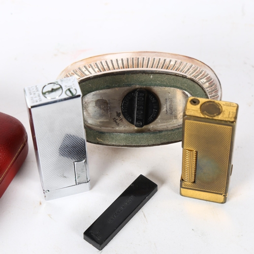 138 - A Vintage Dunhill gold plated lighter in original case, a Ronson silver plated table lighter, and a ... 