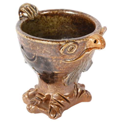 140 - An unusual glazed stoneware eggcup on stand, in the form of a chicken, H5.5cm