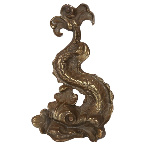 163 - A cast-brass doorstop in the form of a dolphin, H35cm