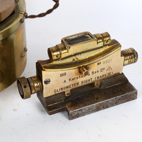 165 - A military gimballed brass compass, plate bearing GA/893, and a clinometer sight (Mk III), by A Kers... 