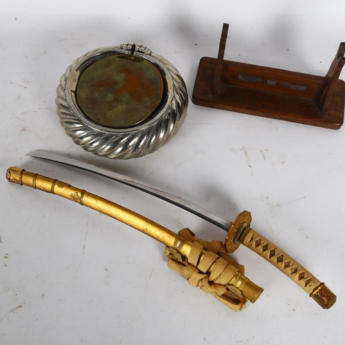 167 - A desk-top study of a Japanese Samurai Tanto, on stand, L36cm, and an African slave bangle made into... 