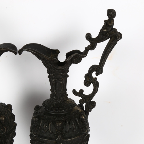 194 - A pair of Renaissance style cast-bronze ewers, ornately decorated with Bacchanalian scenes, with che... 