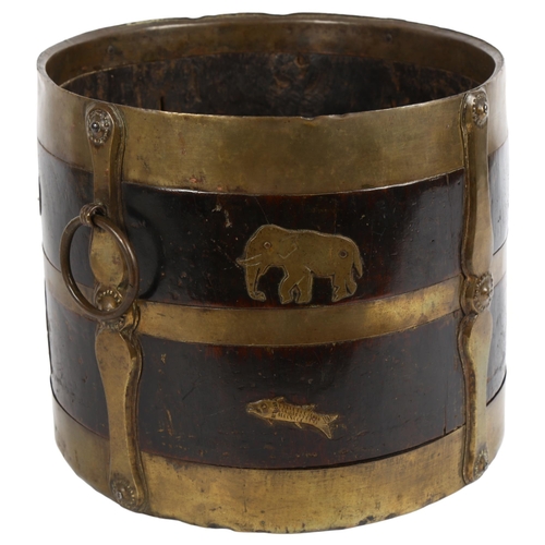 2 - A 19th century Indian wood and brass-bound bucket with ring handles, stylised strapwork and animal d... 