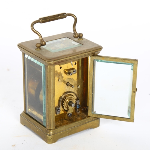 220 - A French brass-cased carriage clock, white enamel dial with Roman numerals and bevelled glass exhibi... 