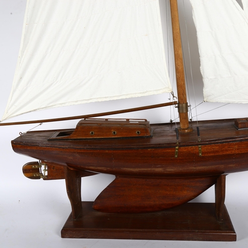 223 - A Vintage wooden-hulled scratch-built model pond yacht, hull length 90cm, overall height 130cm