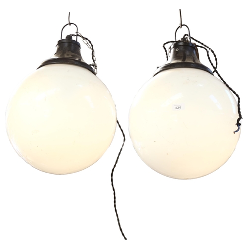 224 - A pair of modern globular pendant light fittings, drop including bracket 60cm