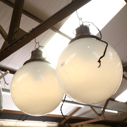 224 - A pair of modern globular pendant light fittings, drop including bracket 60cm