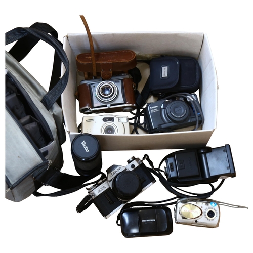 230 - A quantity of Vintage cameras and equipment, including a Canon AE-1, with 28mm lens, in carry case w... 