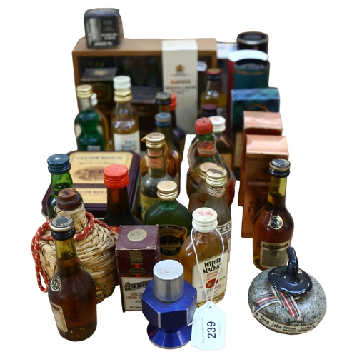 239 - A quantity of alcoholic miniatures, including Scotch, Harvey's Bristol Cream, Glenmorangie Scotch Wh... 