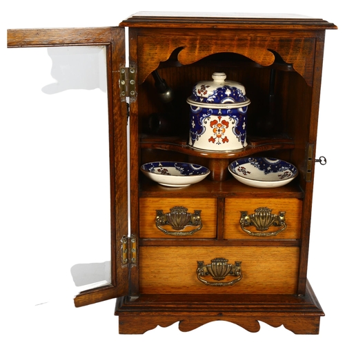 258 - A Victorian oak smoker's cabinet, with mixing bowl and various accessories, H43cm