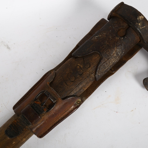 261 - A Vintage fireman's axe, stamp on axe undecipherable but appears to read Sheffield, markings on leat... 