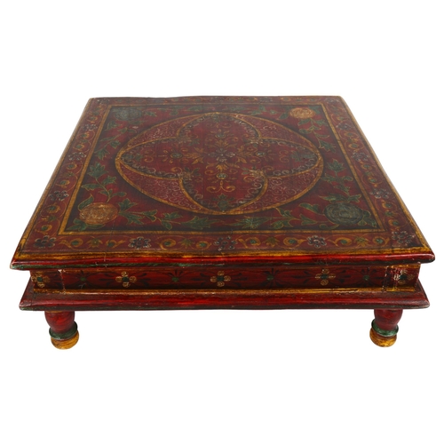 265 - A Middle Eastern style low-centred coffee table with printed design, H15cm, 46cm square